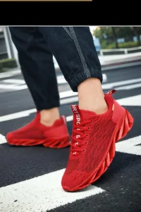 Bright red breathable flying knit mesh running shoes for men with athletic blade sole
