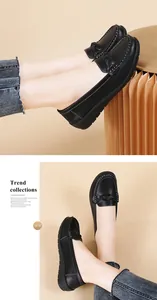Detailed view of black flat loafers with woven strap and textured leather finish.