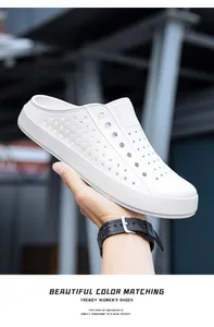 Close-up of white breathable clogs featuring a lightweight and non-slip design for beach