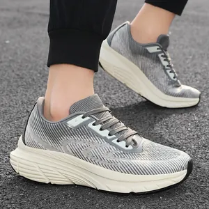 Close-up side view of men's wide-toe running shoes with breathable grey flyknit texture