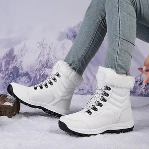 Warm women's mid-top snow boots with white faux fur lining for winter outdoor travel