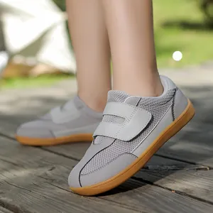 Grey breathable children's wide-toe sneakers with velcro straps and gum sole