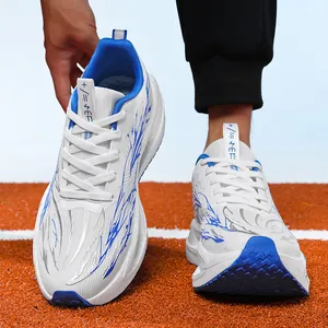 Lightweight boys' running shoes with blue flame patterns on a red track background