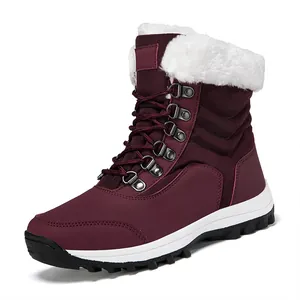 Burgundy women's mid-top snow boots with white faux fur lining and rugged sole