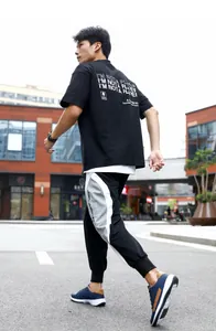 Dynamic action shot of men's navy blue leather sneakers for outdoor running and leisure.