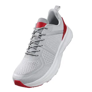 Detailed macro view of grey and red breathable mesh running shoe with white cushion sole