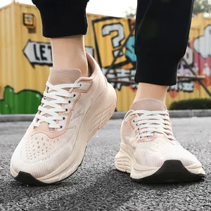 Close-up of breathable knit men's sneakers with wide toe box design.