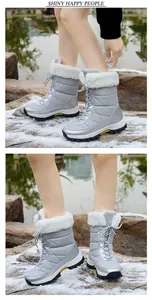 Warm women's silver snow boots with plush lining, non-slip sole and lace-up design
