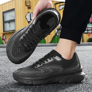 Detailed side view of men's breathable black fly-knit wide-fit running shoes for wide feet