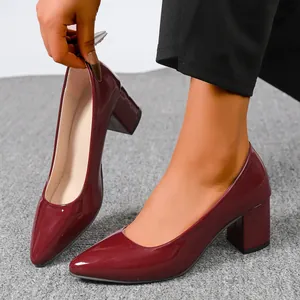 Elegant burgundy patent leather chunky heel pumps featuring a stylish pointed toe design
