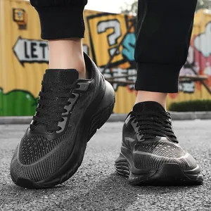 Close-up of black flyknit wide-toe running shoes for men with thick cushioning sole.