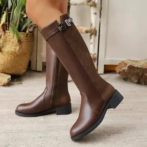 Stylish brown knee-high riding boots featuring a decorative metal buckle and side zipper