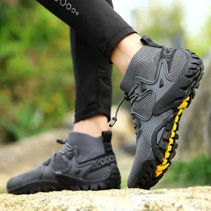 Detail of non-slip rubber sole on grey mid-top outdoor hiking water shoes