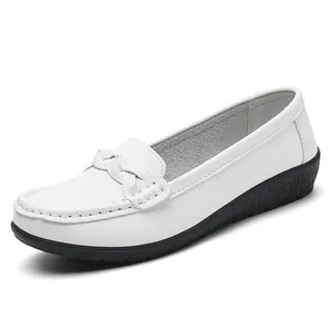 Elegant white leather loafers with braided strap and durable black rubber sole.