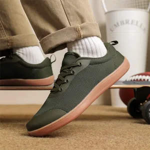 Close-up detail of army green wide toe barefoot sneakers with breathable knit mesh