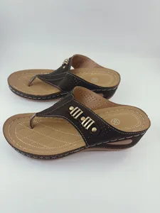 Brown wedge thong sandals with hollow-out design and contrast stitching