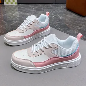 Stylish women's low-top patchwork sneakers with pastel pink and blue leather accents