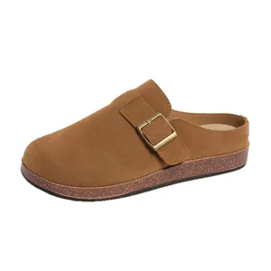 Classic brown suede mules with a vintage metal buckle and comfortable cork sole
