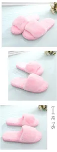 Detail view of pink faux fur open-toe slippers with soft plush texture for home comfort.