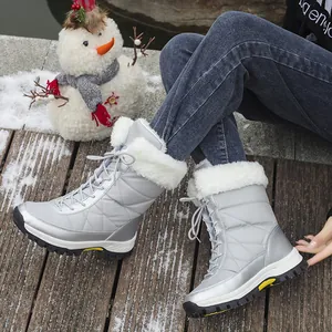 Silver winter snow boots for women with warm white fur lining and non-slip soles