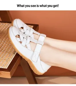 Detailed view of white summer hollow flat sandals with adjustable hook-and-loop straps