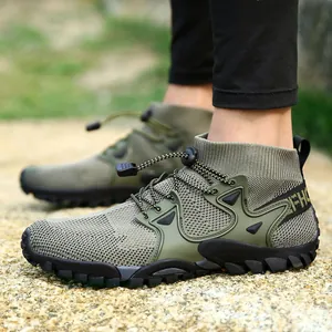 Detail of green mid-top hiking water shoes with non-slip sole and breathable mesh