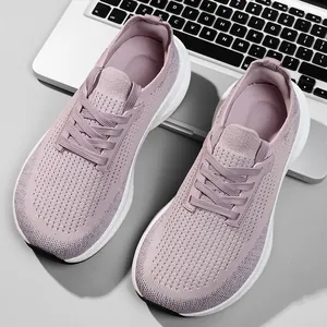 Detailed top view of purple flyknit mesh running shoes featuring a breathable wide toe box