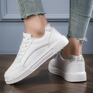 Women's stylish white low-top leather sneakers with holographic heel accent detail