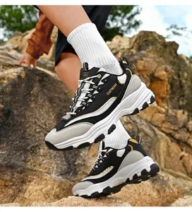 Detail view of men's retro chunky sneakers with thick platform soles in an outdoor setting