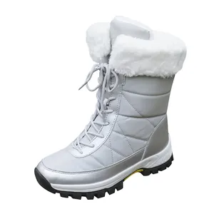 Women's silver mid-calf snow boots with white faux fur lining and lace-up front