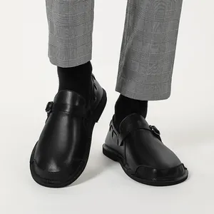 Detailed close-up view of retro black wide toe genuine leather shoes with buckle strap