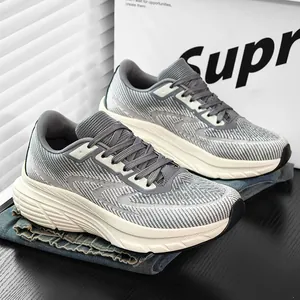Detailed macro view of grey breathable fly-knit athletic shoes for men with wide feet