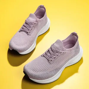 Close-up of lightweight lavender women's mesh running shoes on a vibrant yellow background
