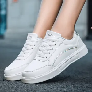 Stylish women's white low-top platform sneakers with silver holographic detail