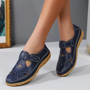 Navy blue hollow-out flat sandals for women featuring Velcro strap and non-slip sole