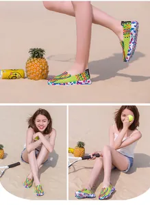 Lifestyle view of colorful breathable woven slip-on shoes for women on a sunny beach