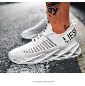 Close-up of white breathable mesh running shoes with unique blade-style platform soles.