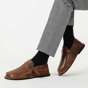 Detailed side view of vintage brown leather wide-toe barefoot casual shoes for men