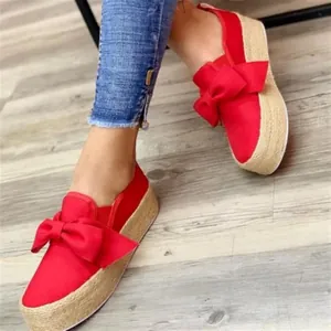 Women's stylish red platform espadrille loafers featuring large bow and jute sole