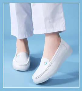 Close-up of white breathable nurse shoes with heart logo on soft thick anti-slip sole