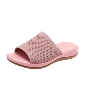 Close-up of pink flying woven leisure flat slippers for women with soft sole