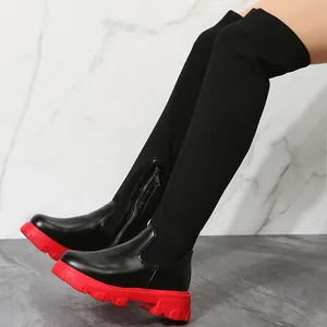 Stylish black fly-knit over-the-knee boots with chunky red thick soles for women.