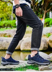 Men's navy blue outdoor hiking shoes with durable non-slip soles shown in active use