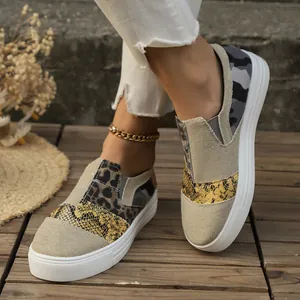 Casual mixed pattern canvas loafers with leopard and snake prints on white platform soles
