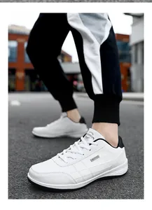 Close-up of white waterproof men's sneakers with black accents for outdoor casual wear