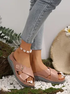 Detail view of women's casual thick sole cross strap sandals in pink with buckle