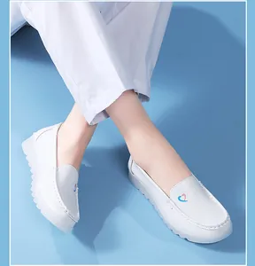 Professional white medical nurse shoes featuring heart logo and thick non-slip wedge soles