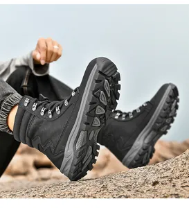 Close-up detail of the durable non-slip lugged rubber soles on black outdoor hiking boots