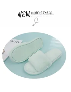 Soft mint green faux fur slide slippers providing indoor comfort and cozy warmth.