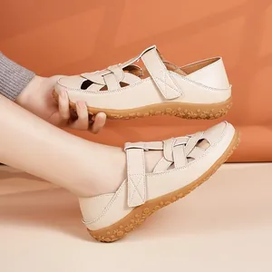 Beige summer flat sandals for women featuring soft soles and breathable cut-out design